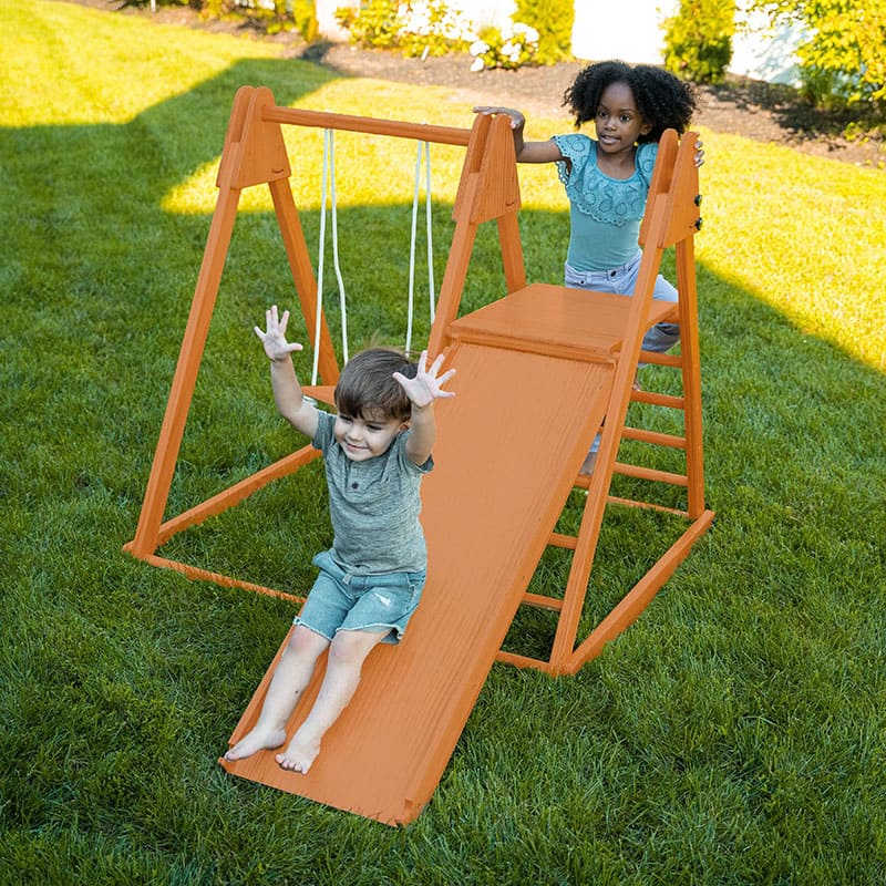 Jupiter indoor/outdoor playset in a yard with kids playing