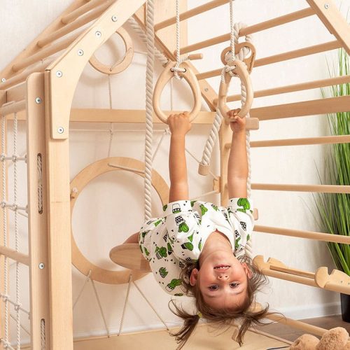 wooden_climbing_playhouse_close_up_girl_hanging