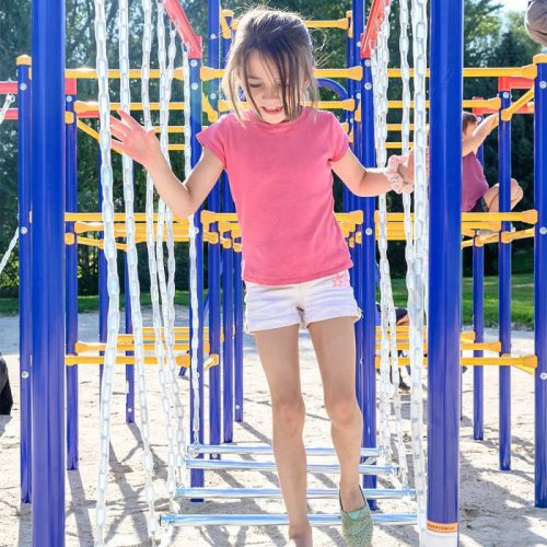 ActivPlayHangingBridgeandHangingJungleLineModularOutdoorPlaysetAccessoryModule SJG207 withgirlplayingonit