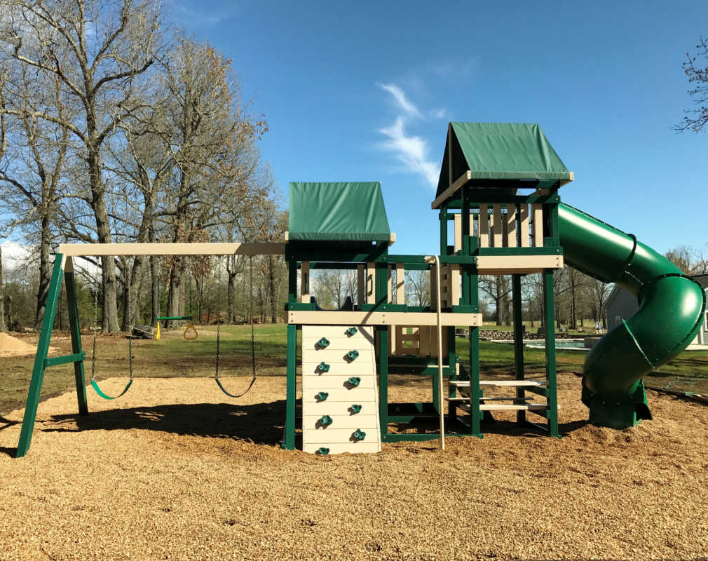 Congo Monkey Playset in green and sand in a backyard