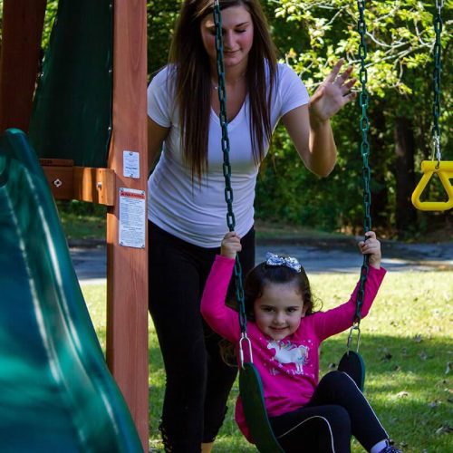 GorillaPlaysetsWoodenSwingSetWithSlideMotherAndDaughterPlayingSwing