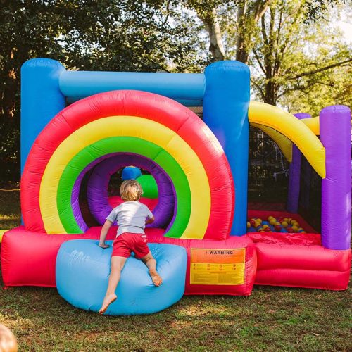 Kid Wise Lucky Rainbow Bounce House Entrance Kid Sitting