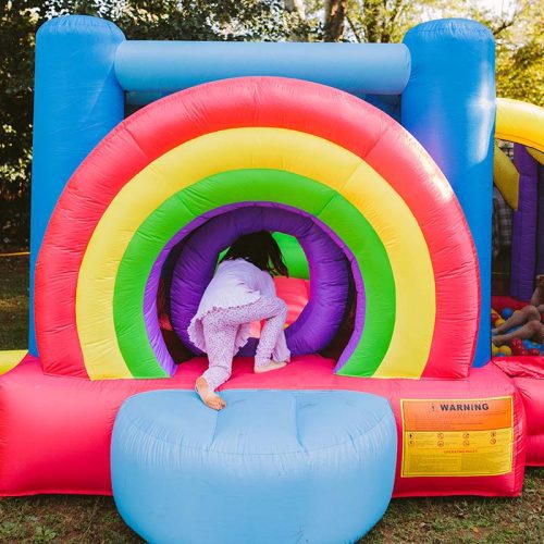 Kid Wise Lucky Rainbow Bounce House Kid In Pink Crawling