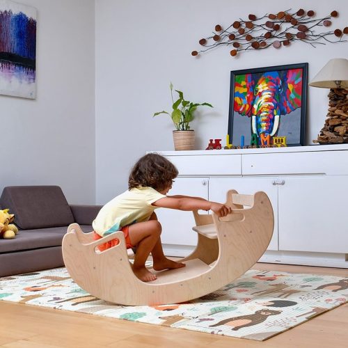 Kidodido2In1MontessoriWoodenSeesawandTableChairSetAKidSittingOnTheLeftSideOfTheSeesawBalancing