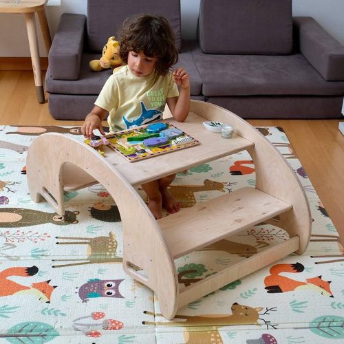 Kidodido2In1MontessoriWoodenSeesawandTableChairSetShowingAKidplayingAWoddenAnimalPuzzles