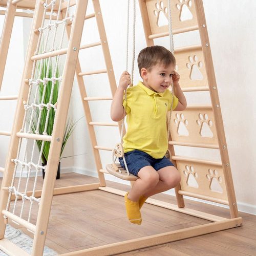 climbing playground boy on swing close up