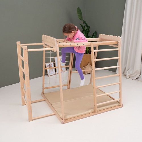 indoor jungle gym girl in pink climbing