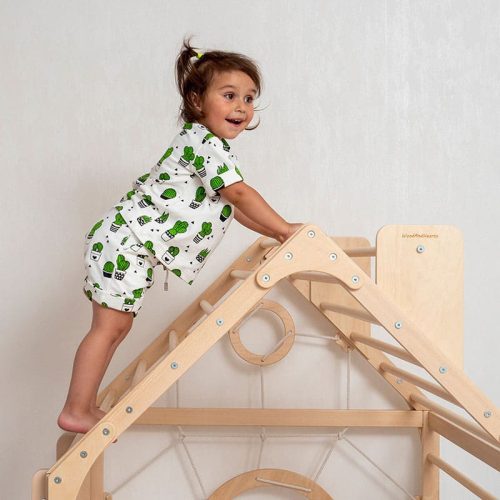 wooden climbing playhouse girl on top close up